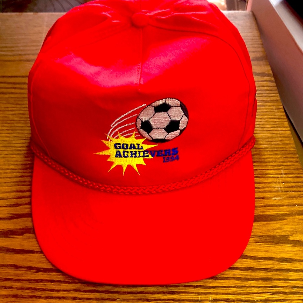 Red Y2K 90’s trucker hat.  Goal Achievers 1994